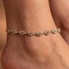 Close-up of Luna Blossom Anklets, gold-tone floral motifs set with clear stones