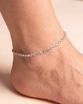 Gilded Braid silver-tone interlocking link anklet worn on an ankle