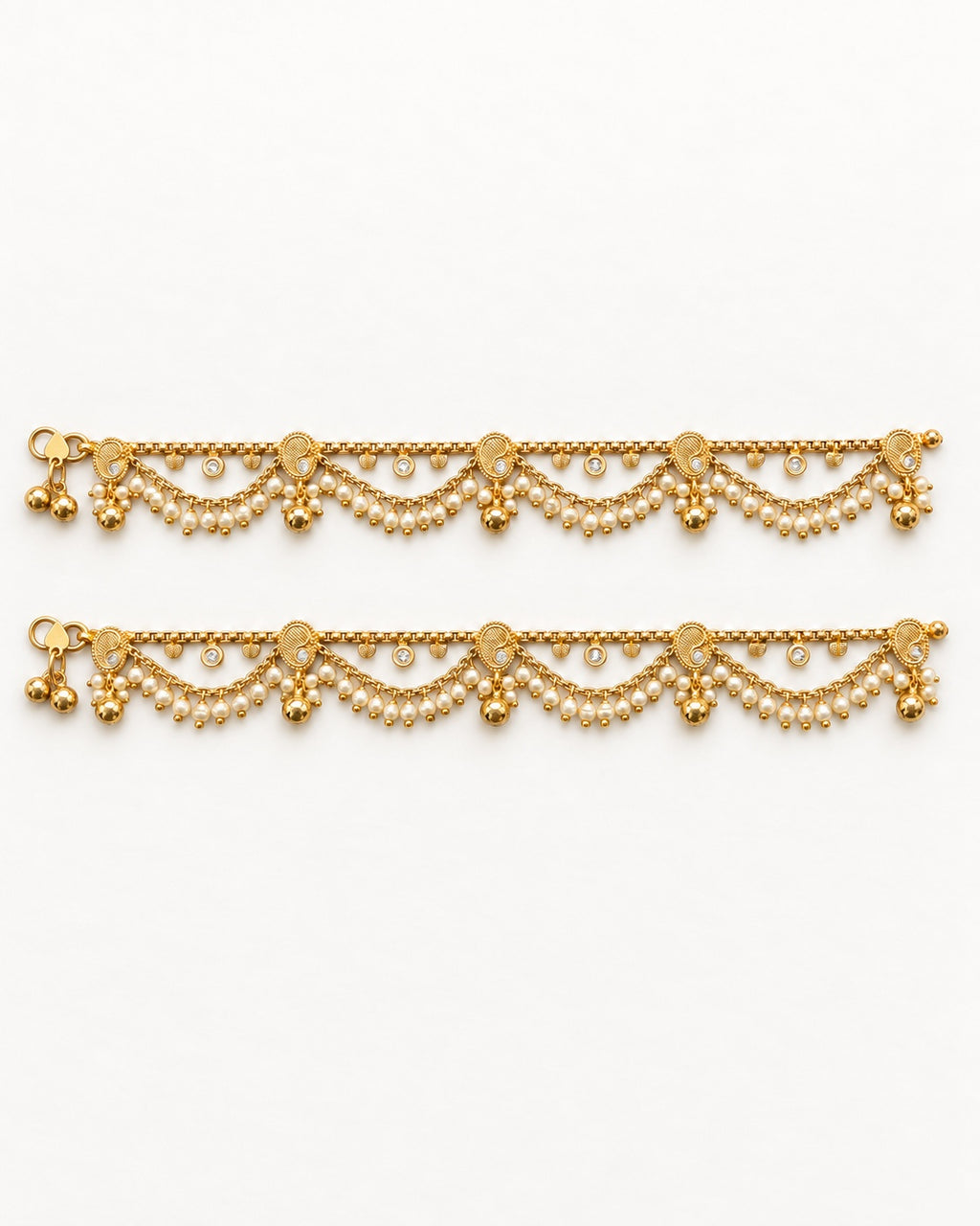 Ava Pearl matching gold-tone anklet pair laid flat with paisley details and pearl-like fringe