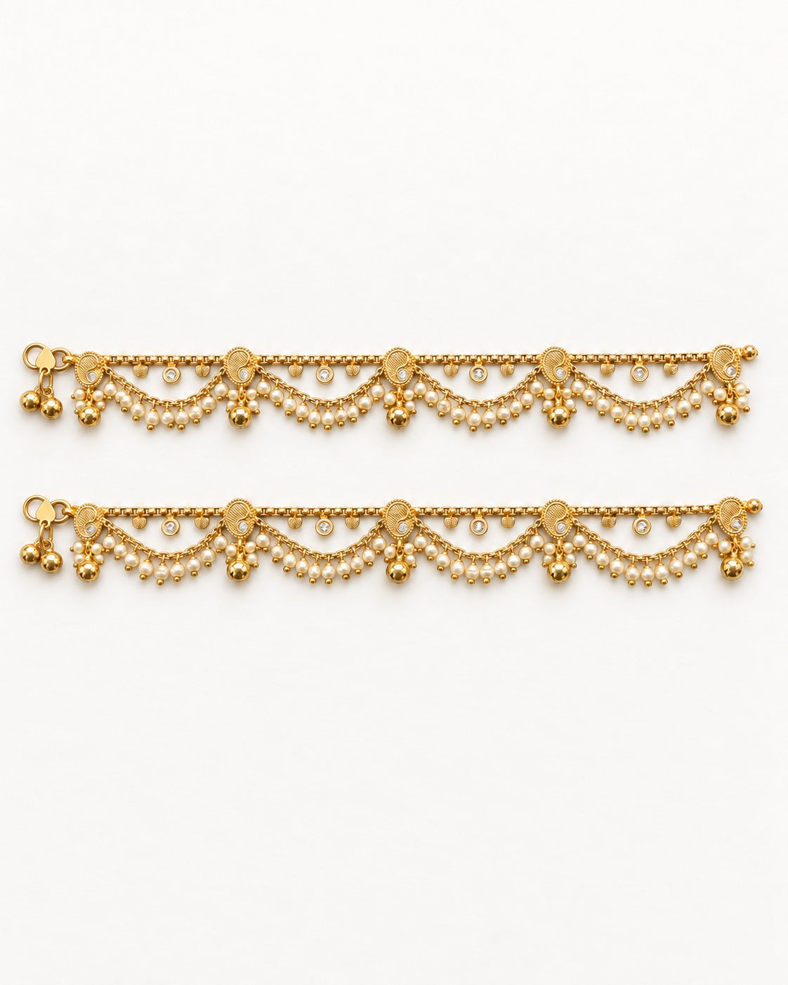 Ava Pearl matching gold-tone anklet pair laid flat with paisley details and pearl-like fringe