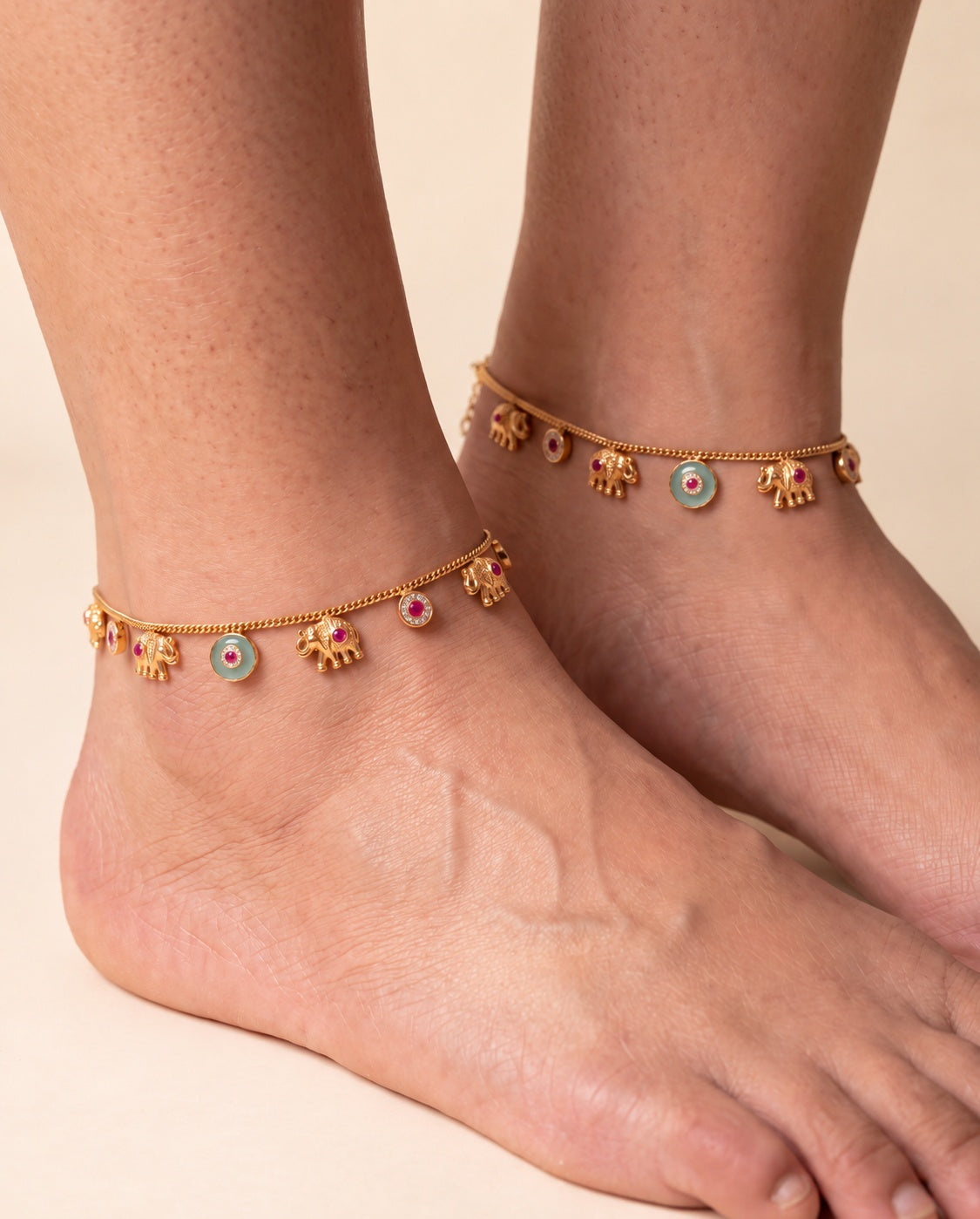 Marigold Bloom anklet pair worn on both ankles showing the elephant charms and colored accents