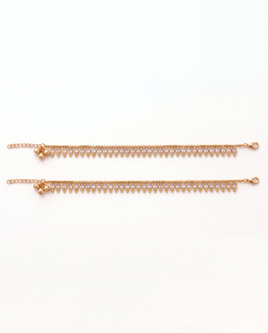 Margot Chime gold-tone anklet pair laid flat, showing the lobster clasp and extension chain