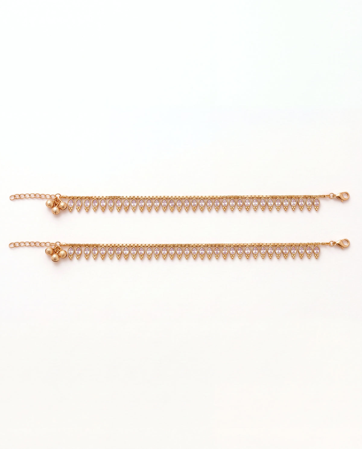 Margot Chime gold-tone anklet pair laid flat, showing the lobster clasp and extension chain