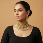 South Asian woman wearing the gold-tone mint choker with matching earrings — bridal look