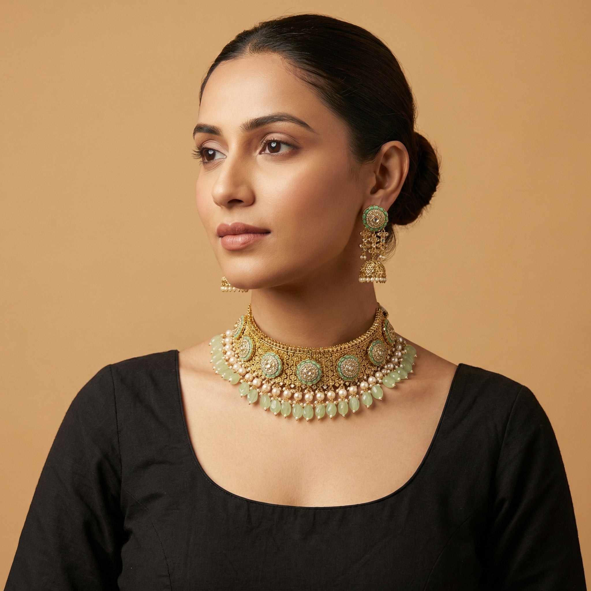 South Asian woman wearing the gold-tone mint choker with matching earrings — bridal look