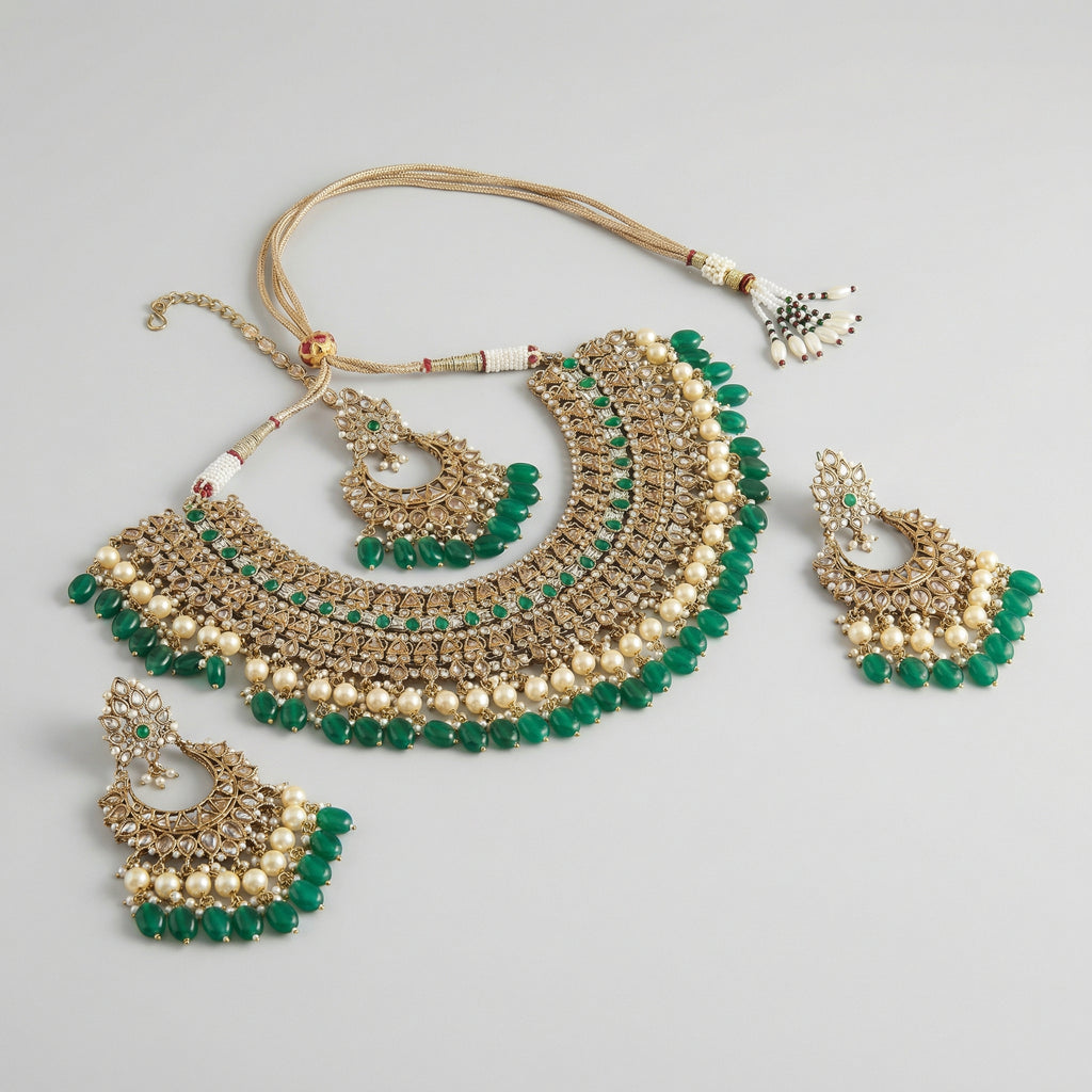 Royal Emerald Necklace Set detail showing polki bib tiers and emerald teardrop fringe