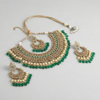 Royal Emerald Necklace Set detail showing polki bib tiers and emerald teardrop fringe