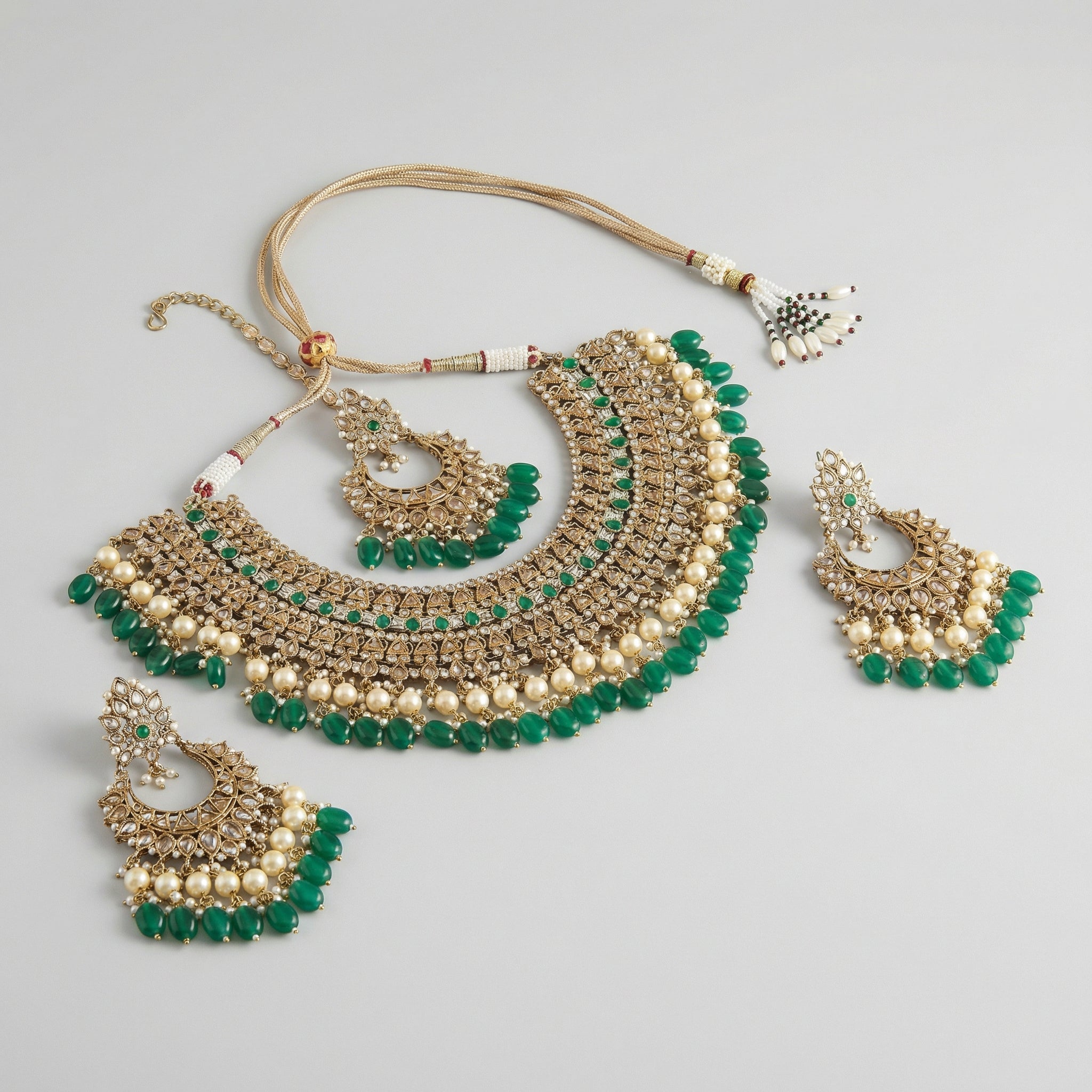 Royal Emerald Necklace Set detail showing polki bib tiers and emerald teardrop fringe