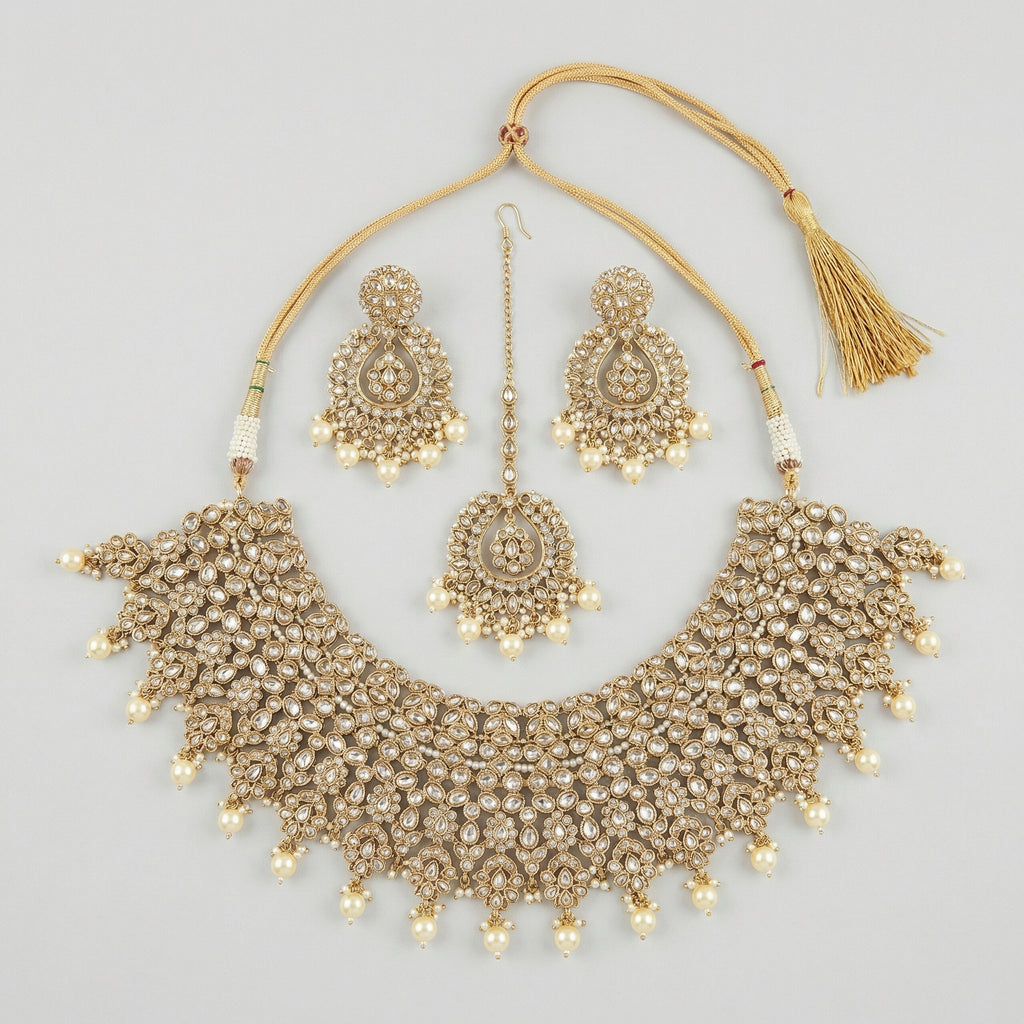 Maharani Kundan Set gold-tone kundan choker with earrings and tikka on gray background