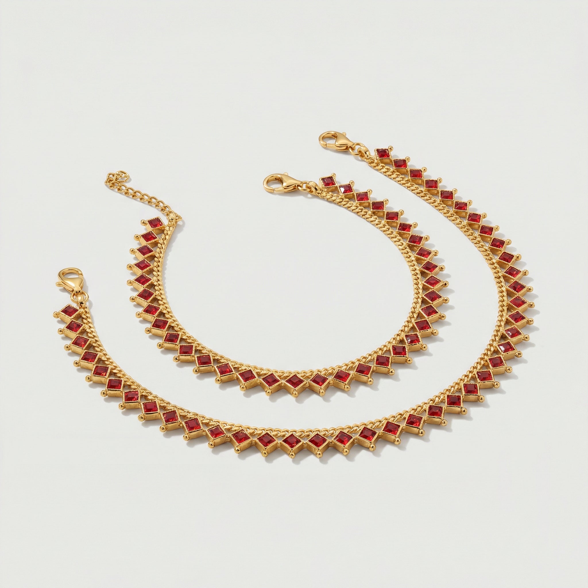 Crimson Gold Payal close-up of prong-set red stones and lobster clasp