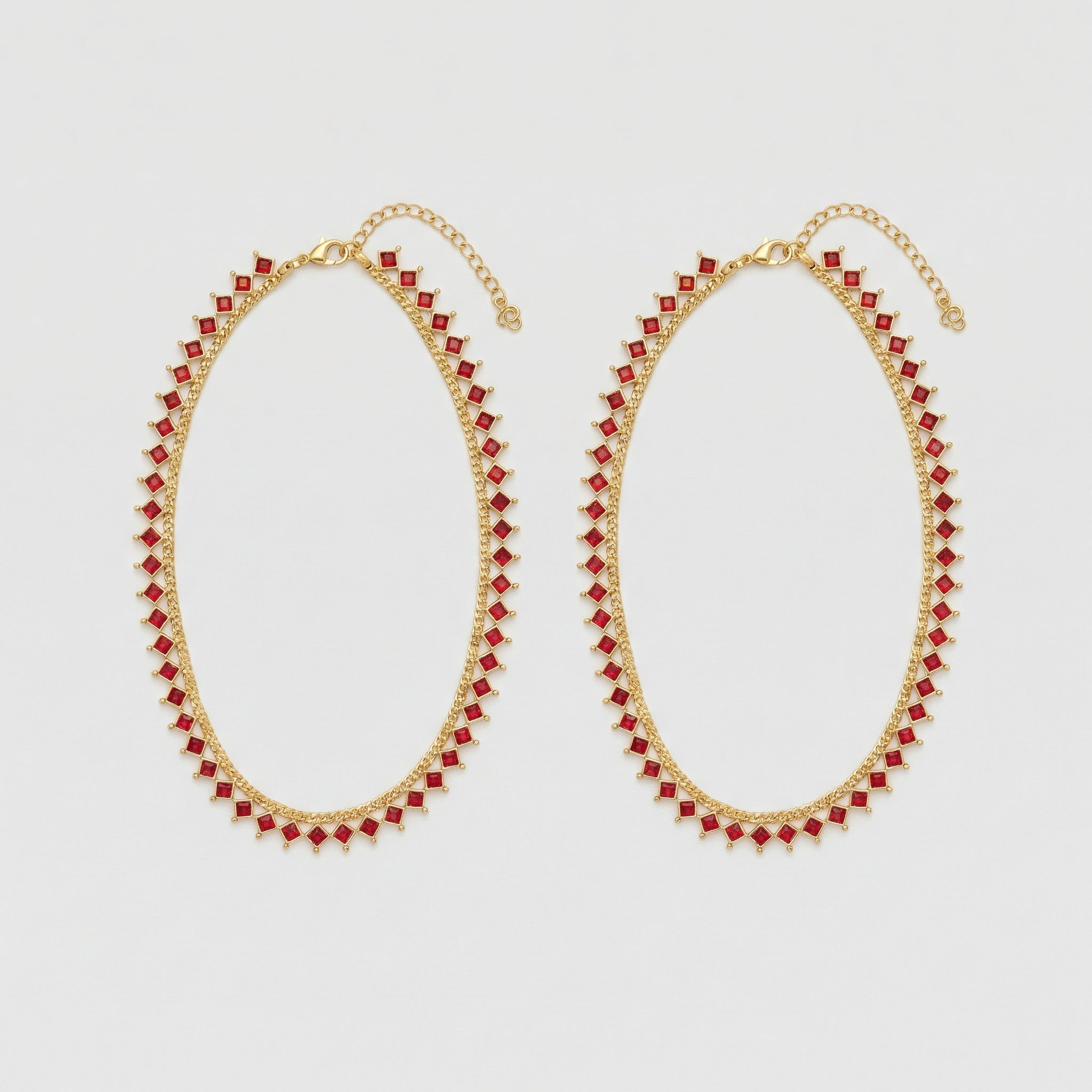 Crimson Gold Payal pair of gold-tone payals with square red gemstones and extender chain