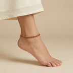 Crimson Gold Payal close-up of prong-set red stones and lobster clasp