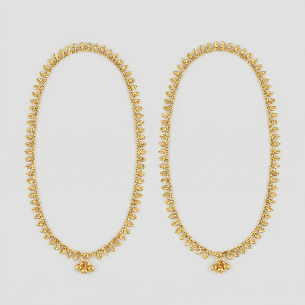 Golden Leaf Anklets pair of gold-tone leaf fringe payals with triple bead accent on gray background
