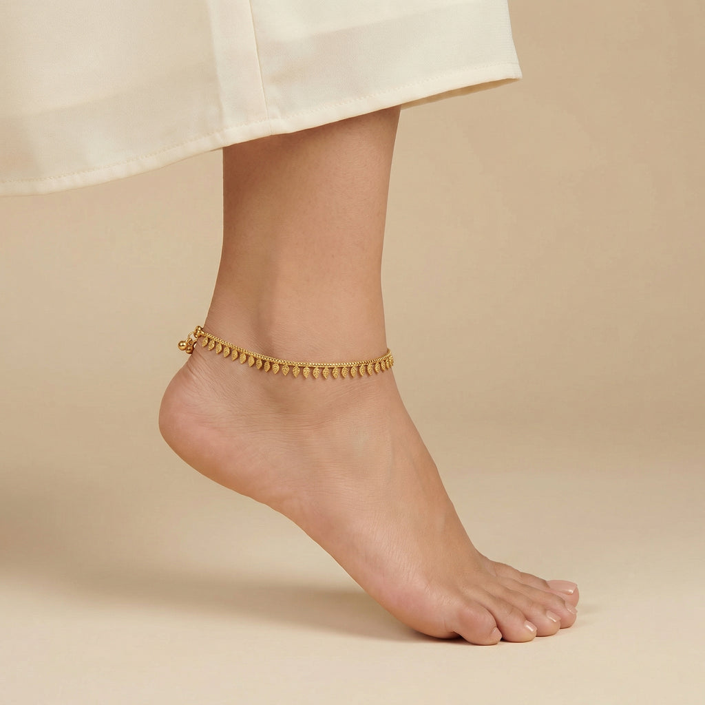 Golden Leaf Anklets detail showing veined leaf charms and polished gold finish