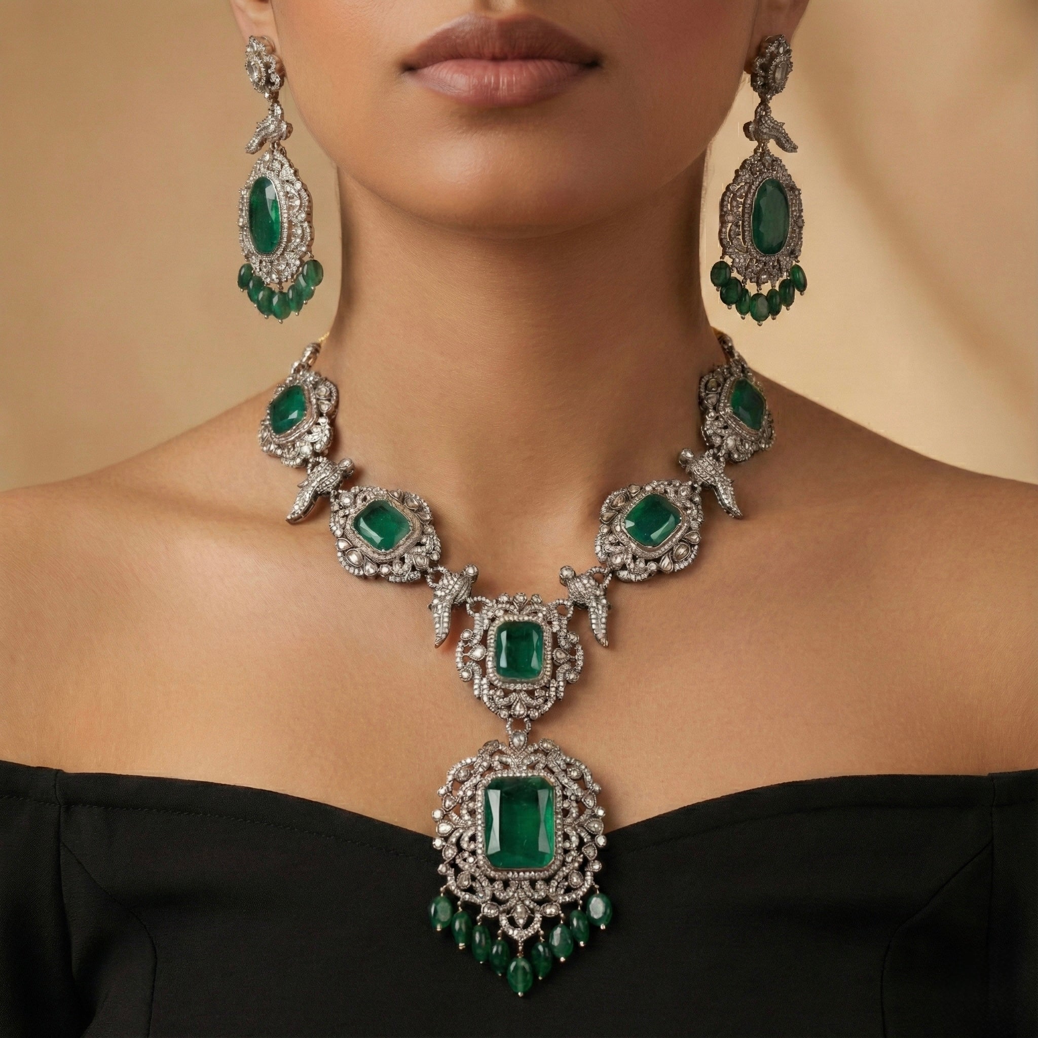 Studio flatlay of the gold-tone emerald statement necklace with matching earrings