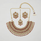 Royal Ruby Kundan Set gold bib necklace with ruby stones, chandbali earrings, and maang tikka