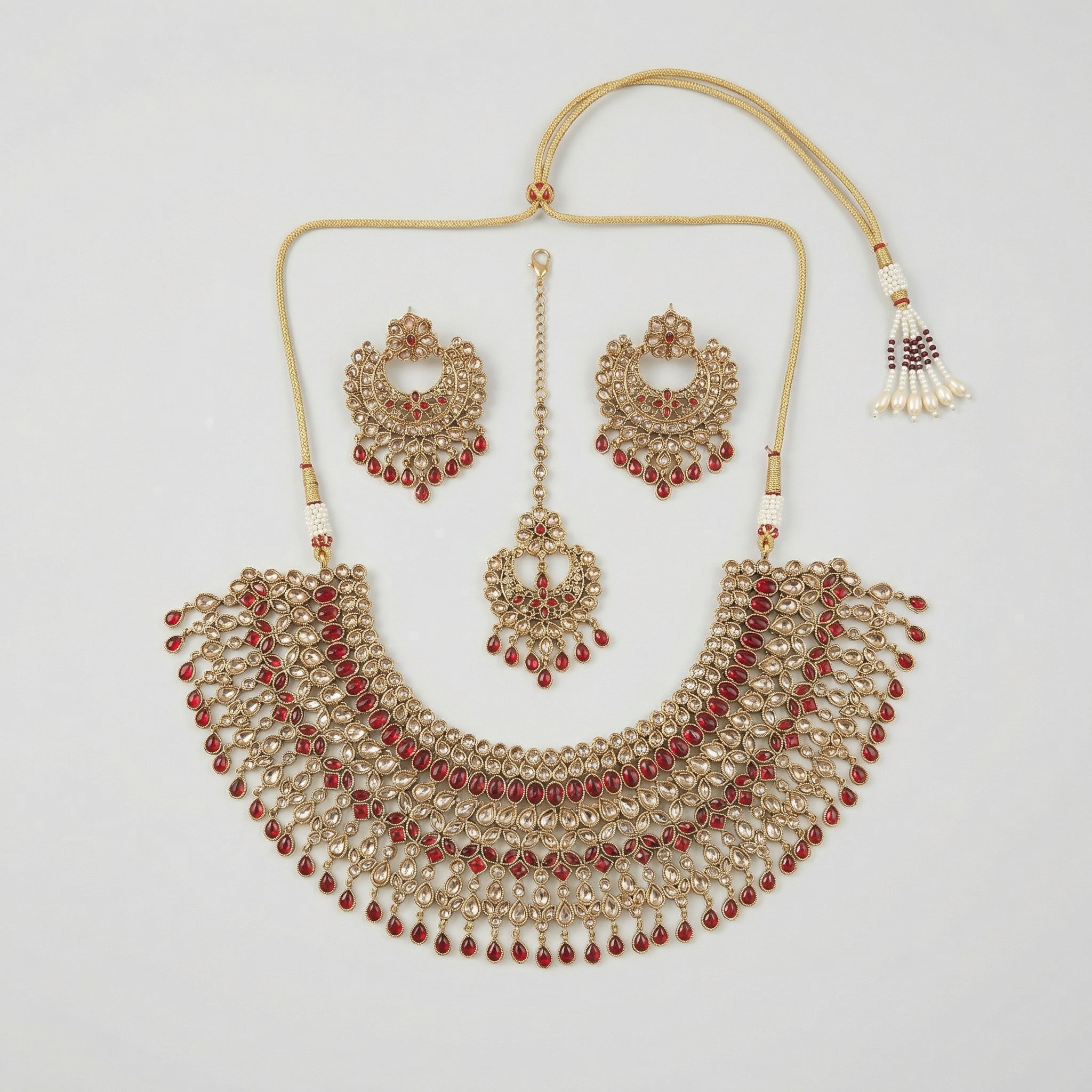 Royal Ruby Kundan Set gold bib necklace with ruby stones, chandbali earrings, and maang tikka