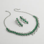 Emerald Vine Necklace Set detail showing emerald green stones and crystal leaf accents