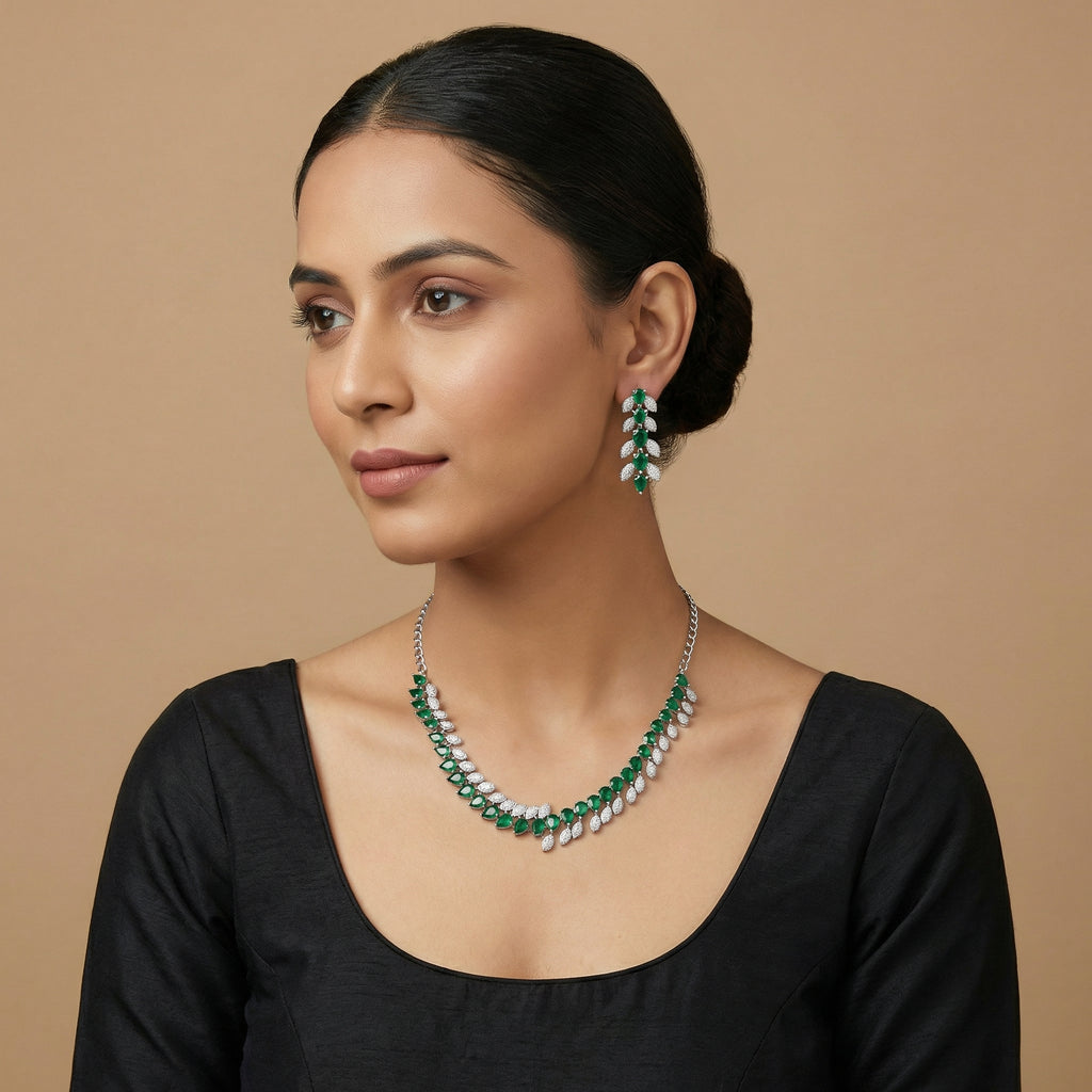 Emerald Vine Necklace Set detail showing emerald green stones and crystal leaf accents