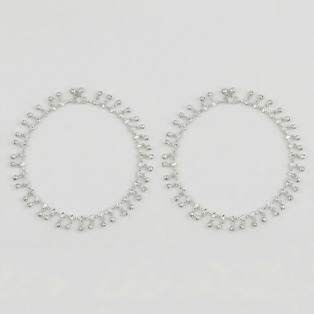Shimmering Charm Anklets pair of silver-tone ghungroo bell payals on gray background