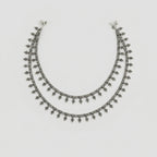 Silver Grapevine Anklets pair of oxidized silver leaf charm payals with ghungroo bells on gray background