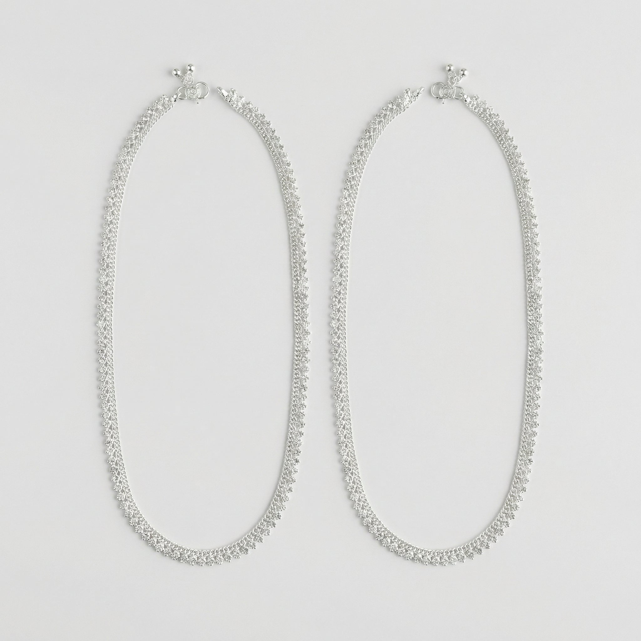 Sterling Sparkle Anklets pair of polished silver-tone scalloped payals with ghungroo beads on white background