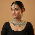 South Asian woman wearing Turquoise Crown Necklace Set with turquoise necklace and earrings — bridal look