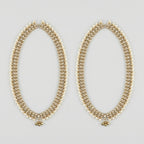 Kundan Pearl Payal pair of gold-tone pearl-bordered payals with ghungroo cluster on gray background