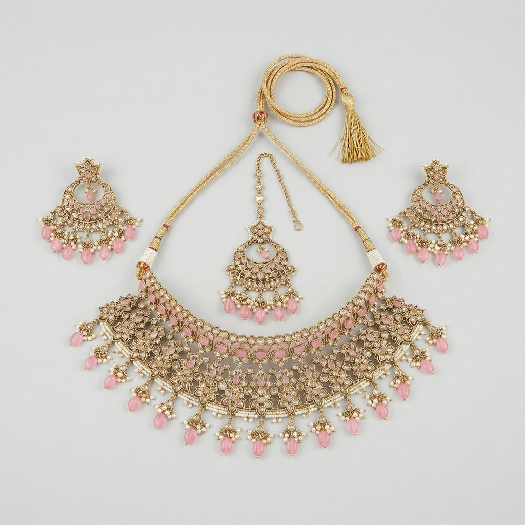 Rose Polki Choker Set gold choker with pink bead fringe, chandbali earrings, and maang tikka on gray background
