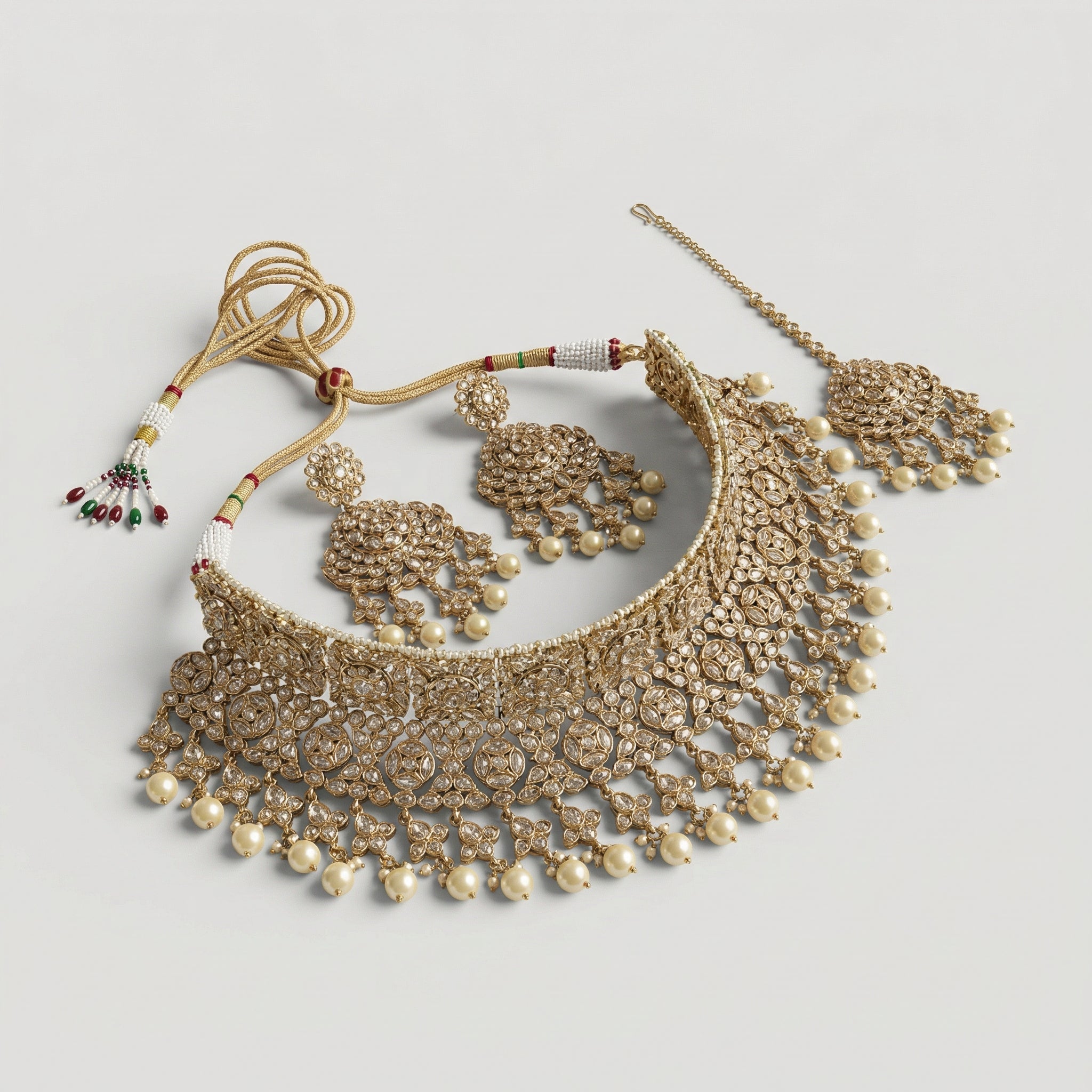 Regal Pearl Necklace Set detail showing clear kundan floral motifs and cream pearl droplet fringe