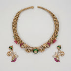 Verdant Royalty Choker Set detail of emerald enamel center and pink floral accents