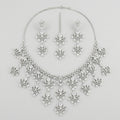 Elegant Silver Statement Set silver-plated statement necklace set with matching earrings in a studio flatlay