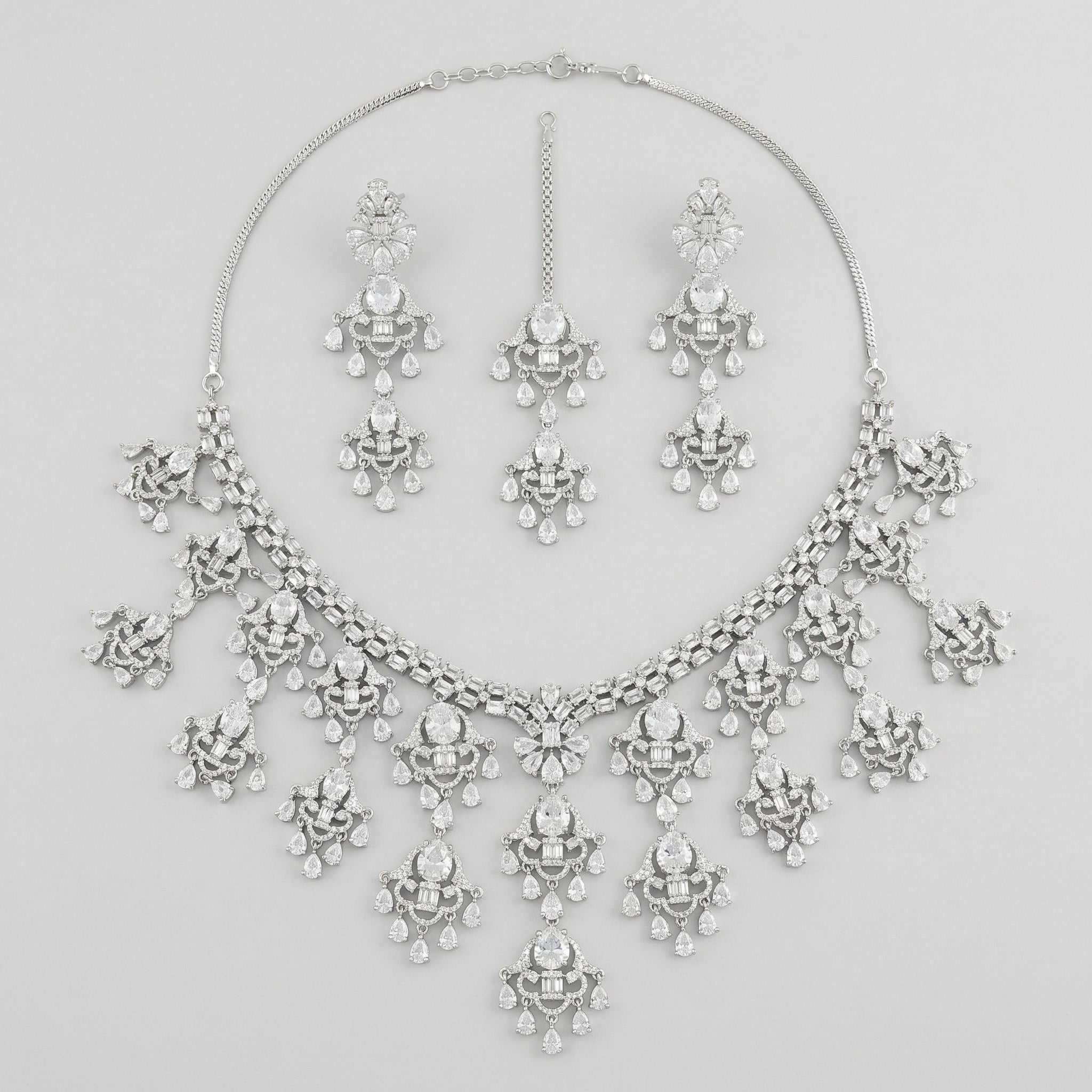 Elegant Silver Statement Set silver-plated statement necklace set with matching earrings in a studio flatlay