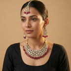 South Asian woman wearing the red kundan necklace set — bridal look.