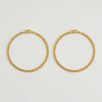 Golden Dotted Chain Anklets pair of gold twisted-chain payals with bead fringe on gray background
