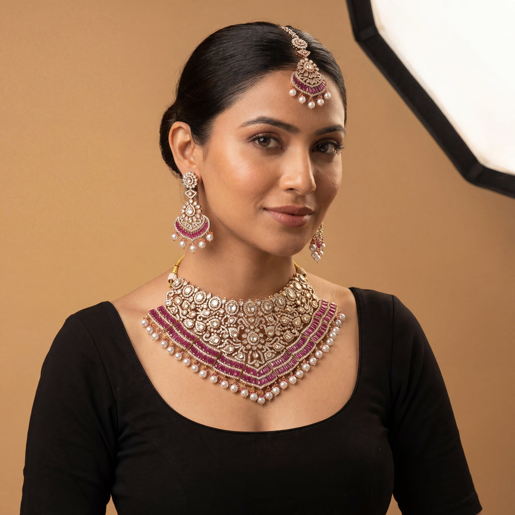 Meera Ruby Radiance Set detail showing ruby-pink stone band, pearl fringe, and crystal filigree work