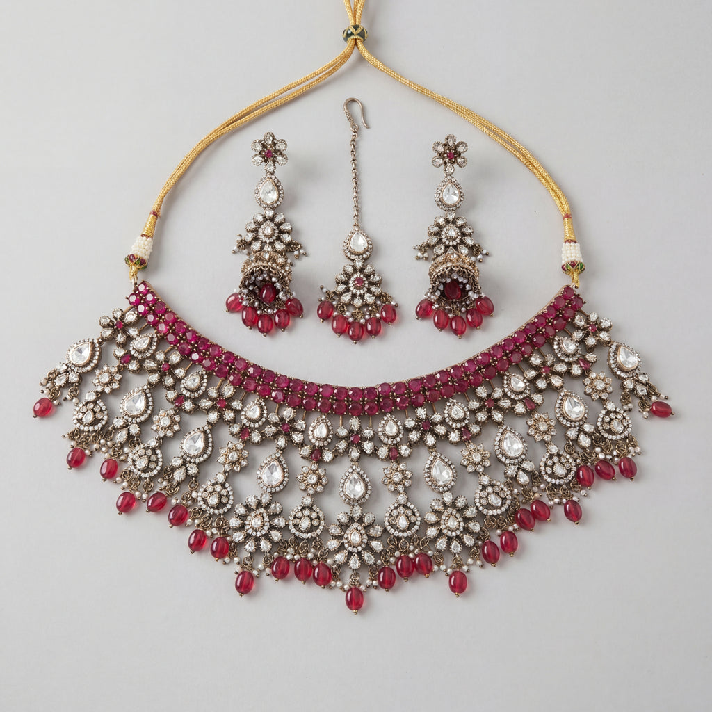 Regal Crimson Choker Set antique silver choker with jhumka earrings and maang tikka on gray background