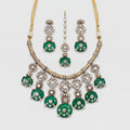 Zaira Emerald Necklace Set silver collar necklace with emerald pendants, earrings, and maang tikka on gray background