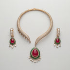 Ruby Emerald Majesty Set gold collar necklace with ruby-emerald pendant and matching drop earrings on gray background