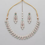 Aria Pastel Necklace Set silver collar necklace with mint and pink stones, earrings, and maang tikka on gray background
