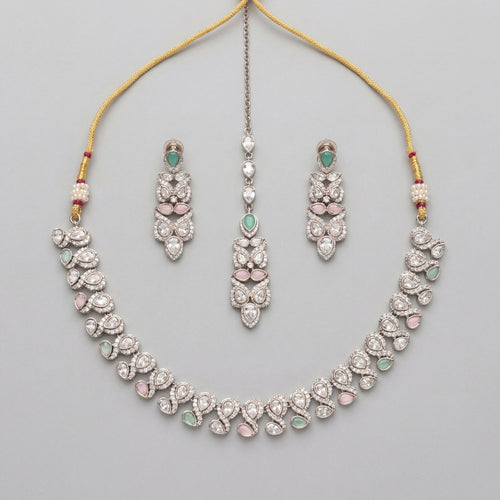 Aria Pastel Necklace Set silver collar necklace with mint and pink stones, earrings, and maang tikka on gray background