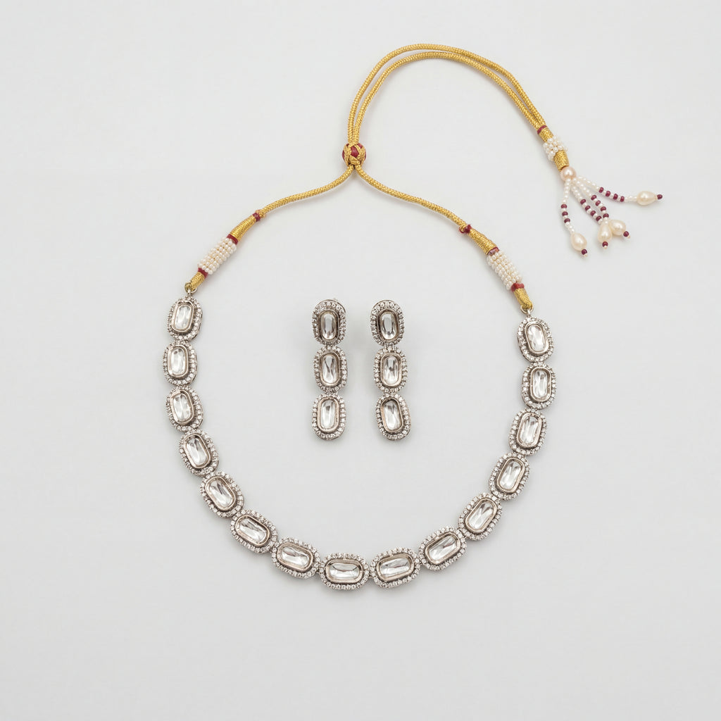 Elara Silver Polki Set silver oval polki collar necklace with matching drop earrings on gray background