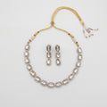 Elara Silver Polki Set silver oval polki collar necklace with matching drop earrings on gray background