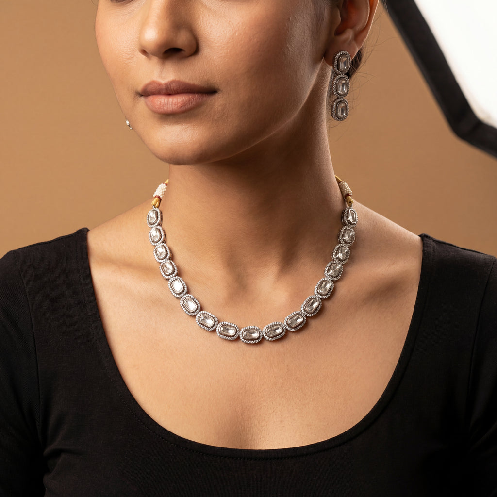 Elara Silver Polki Set detail showing clear polki center stones, crystal halos, and gold dori cord with pearl tassels