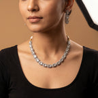 Elara Silver Polki Set detail showing clear polki center stones, crystal halos, and gold dori cord with pearl tassels