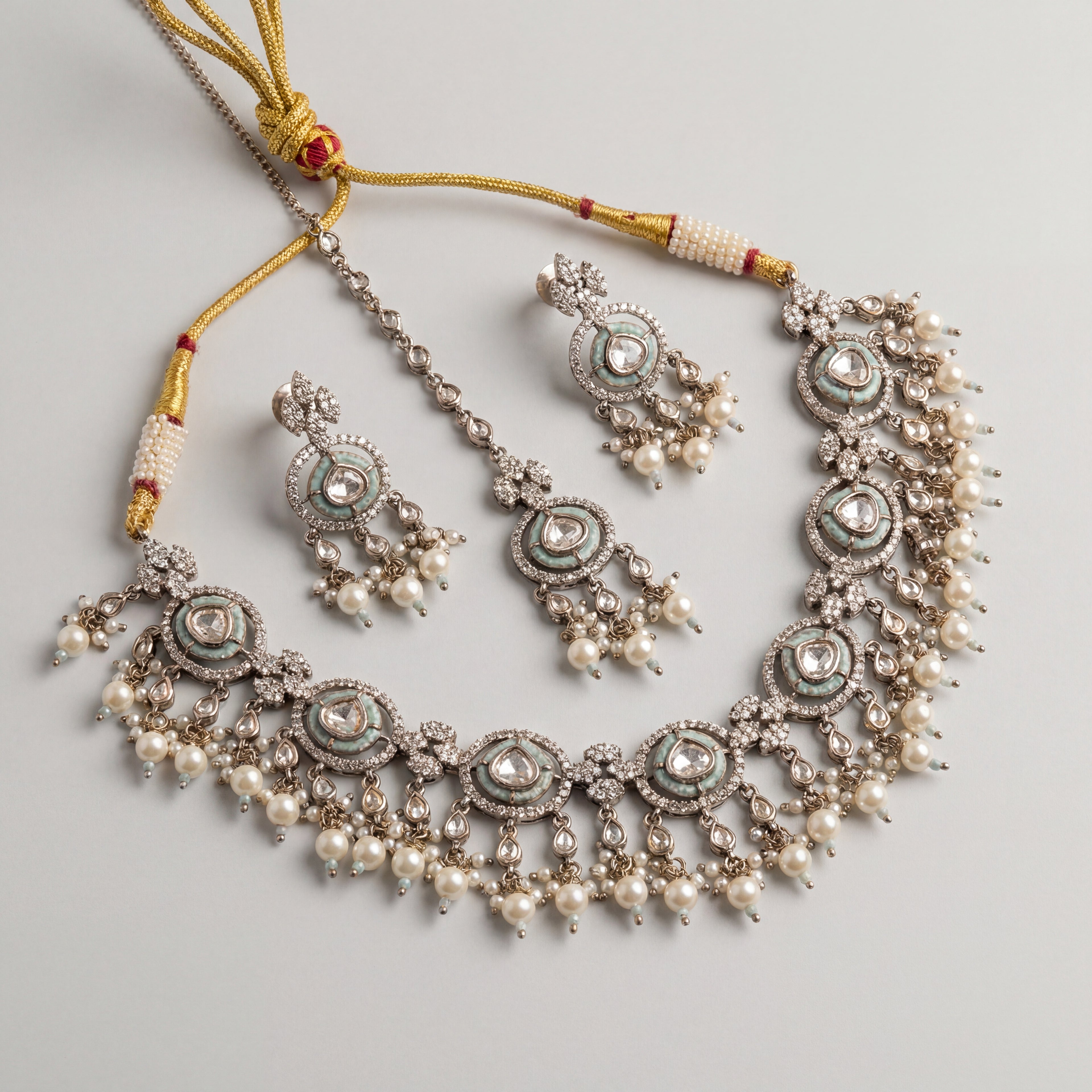Aria Mint Pearl Set detail showing mint-green meenakari borders, polki centers, and pearl drop fringe