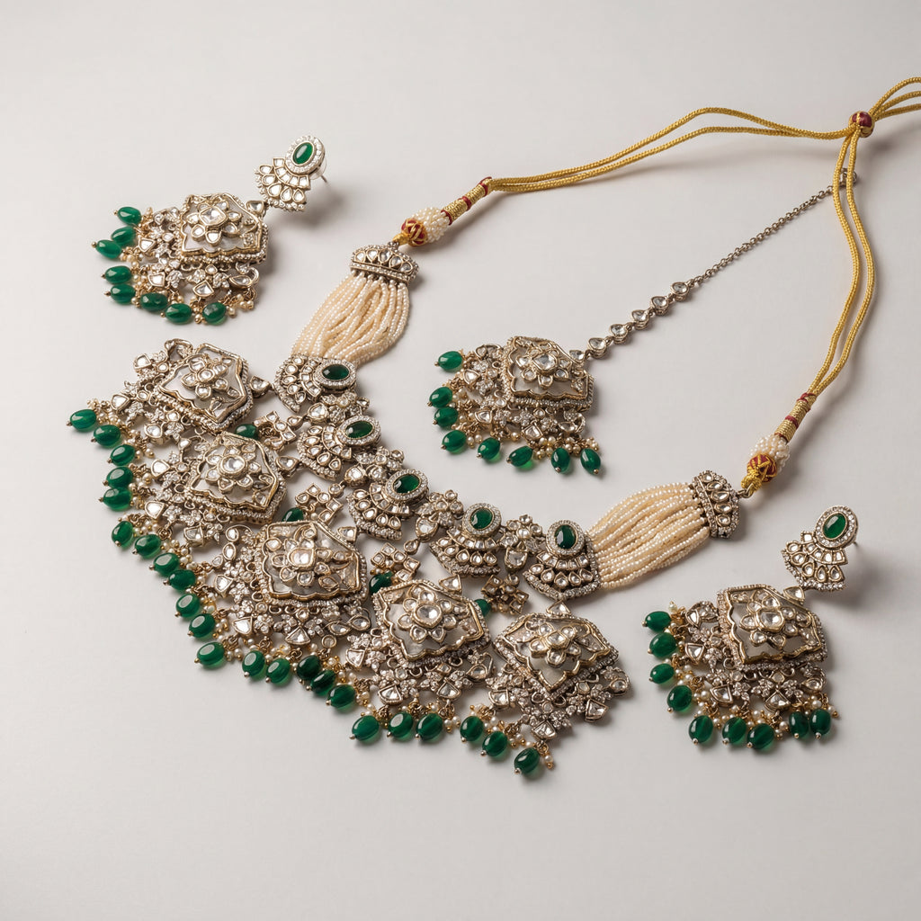 Inara Emerald Necklace Set detail showing emerald teardrop drops, polki filigree, and seed pearl side strands