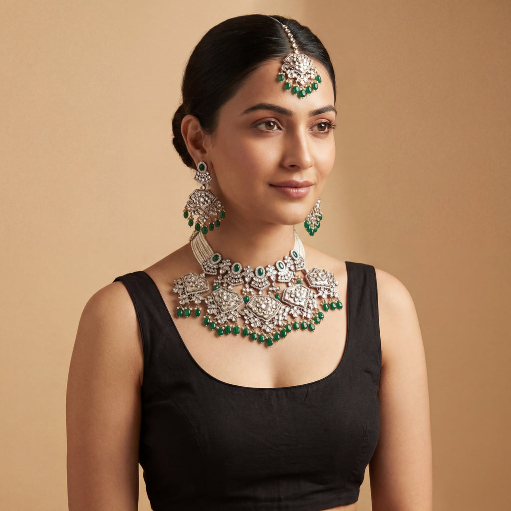 Inara Emerald Necklace Set detail showing emerald teardrop drops, polki filigree, and seed pearl side strands