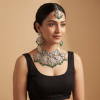 Inara Emerald Necklace Set detail showing emerald teardrop drops, polki filigree, and seed pearl side strands
