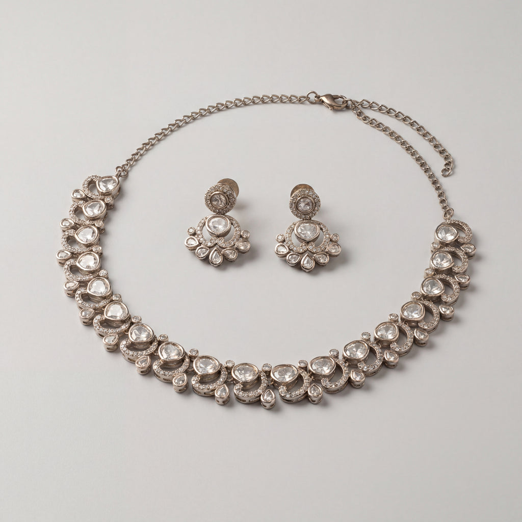 Aria Crystal Necklace Set detail showing clear flat-cut polki stones, crescent halos, and pear-shaped drops